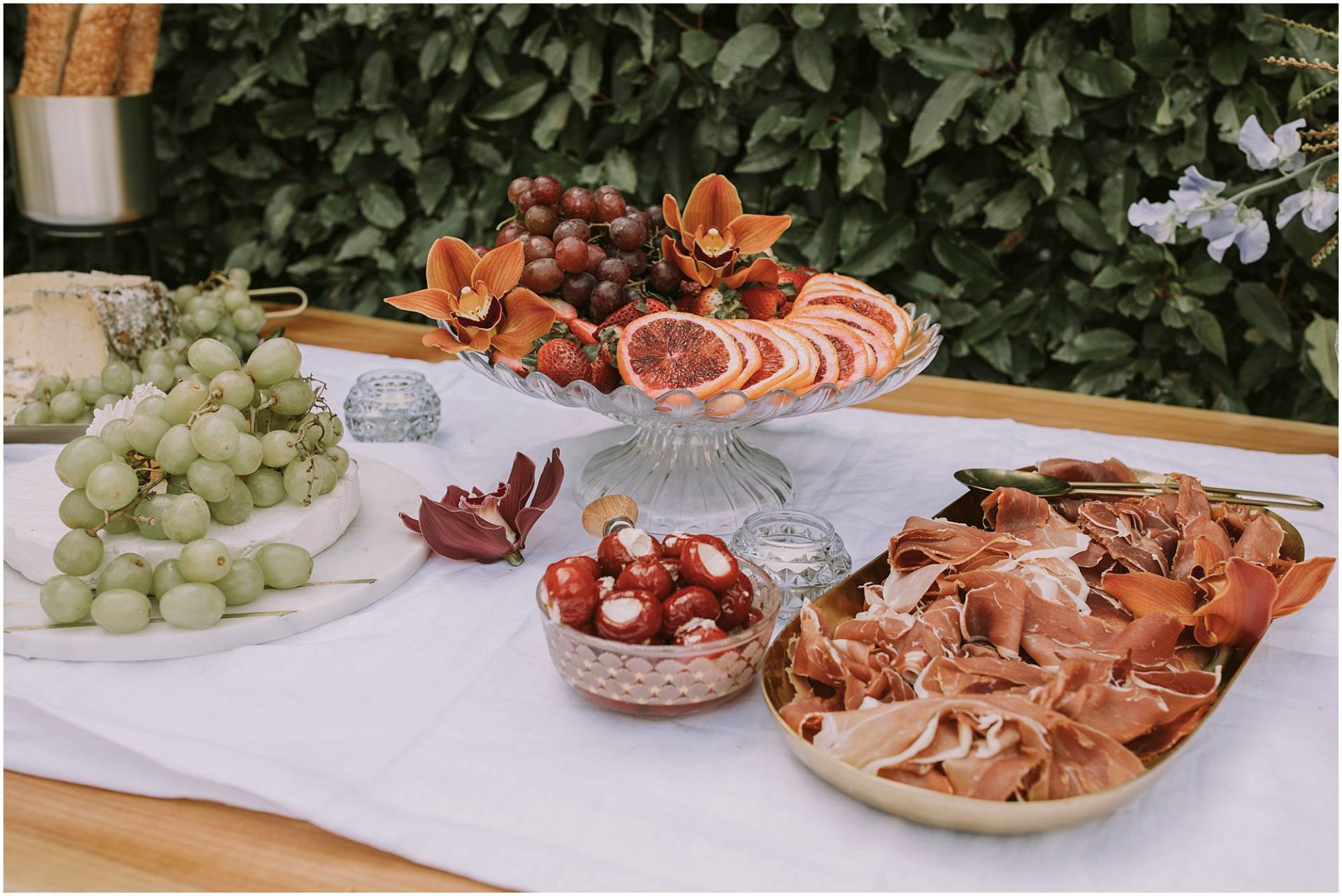 Charlotte Kiri Photography - Commercial Photography of a table of antipasto cheese, fruit, and cured meat for My Secret Picnic in Wanaka, New Zealand.